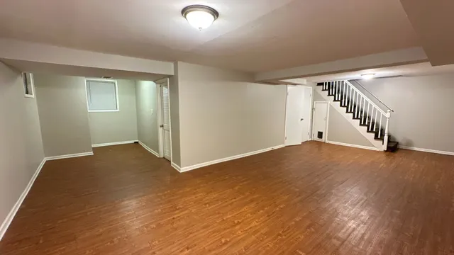 a view of empty room with wooden walls