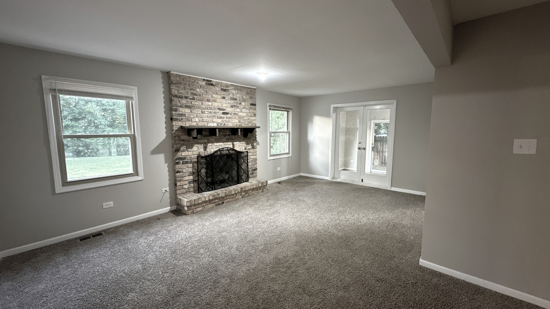 1607 Sylvan Court Flossmoor, IL 60422 - Photo 5 of 21 an empty room with windows and fireplace
