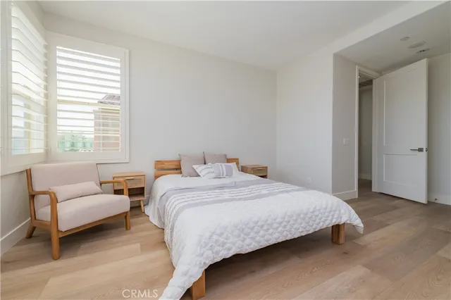 a bedroom with a bed and a couch