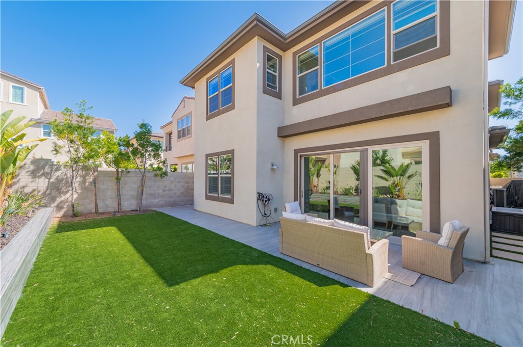 53 Lunar Irvine, CA 92618 - Photo 21 of 21 a view of a house with a yard and a patio