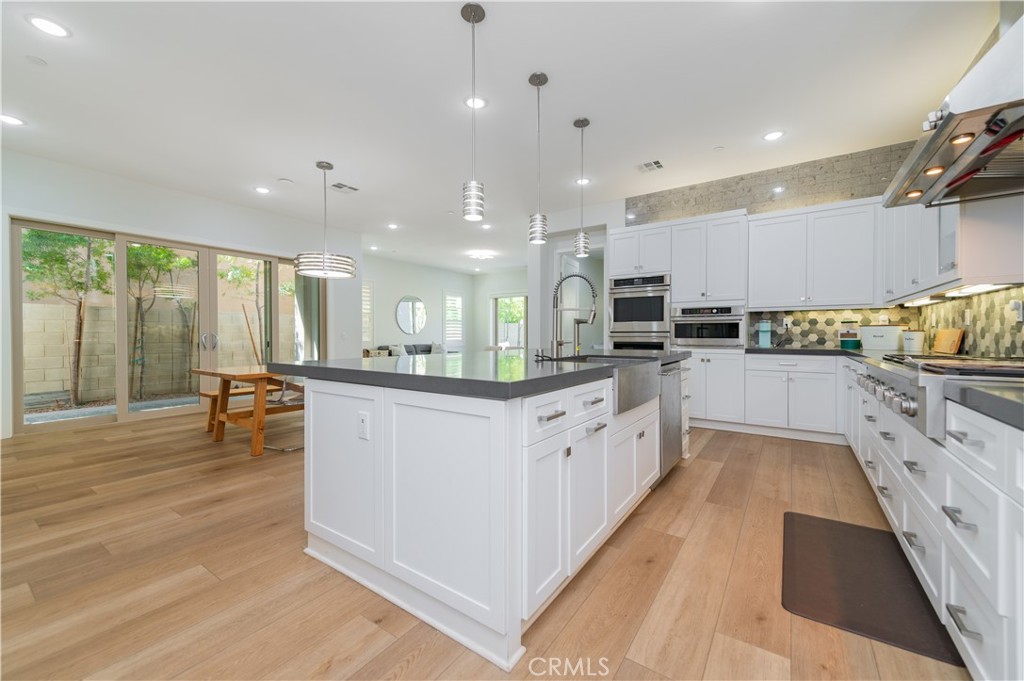 53 Lunar Irvine, CA 92618 - Photo 6 of 21 a large kitchen with stainless steel appliances lots of counter top space