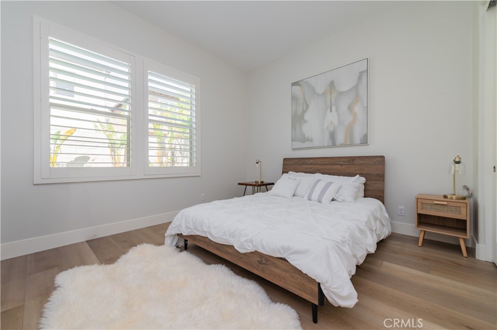 53 Lunar Irvine, CA 92618 - Photo 9 of 21 a bedroom with a bed and a window
