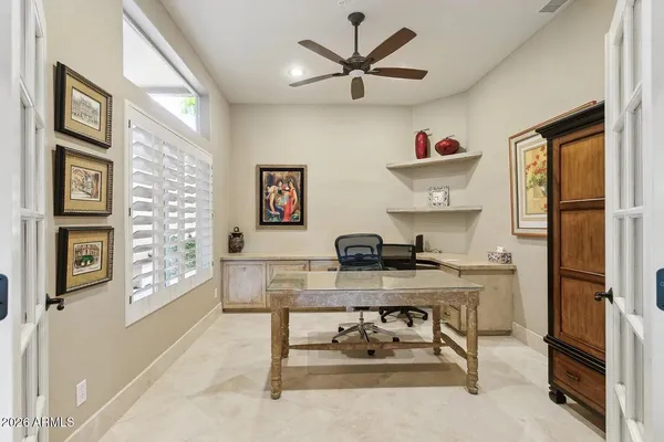 a view of a hallway with a livingroom and furniture