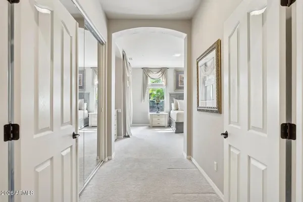 a spacious bedroom with a bed and a fireplace
