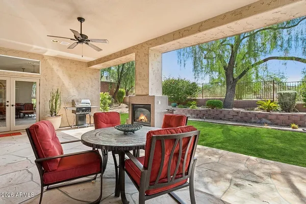 a outdoor dining space with furniture and garden view