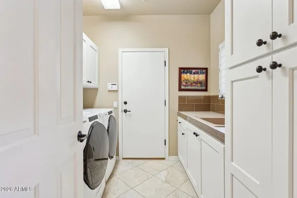 a view of a patio with a fireplace dining table and a chairs