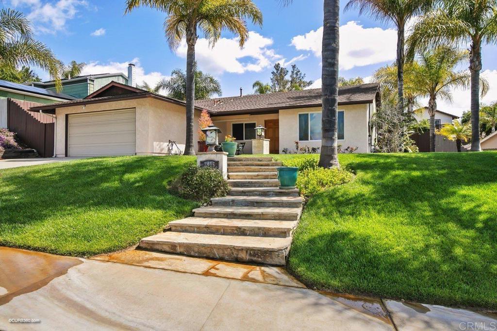 2416 Valley Mill Road El Cajon, CA 92020 - Photo 1 of 1 a front view of a house with a garden and plants