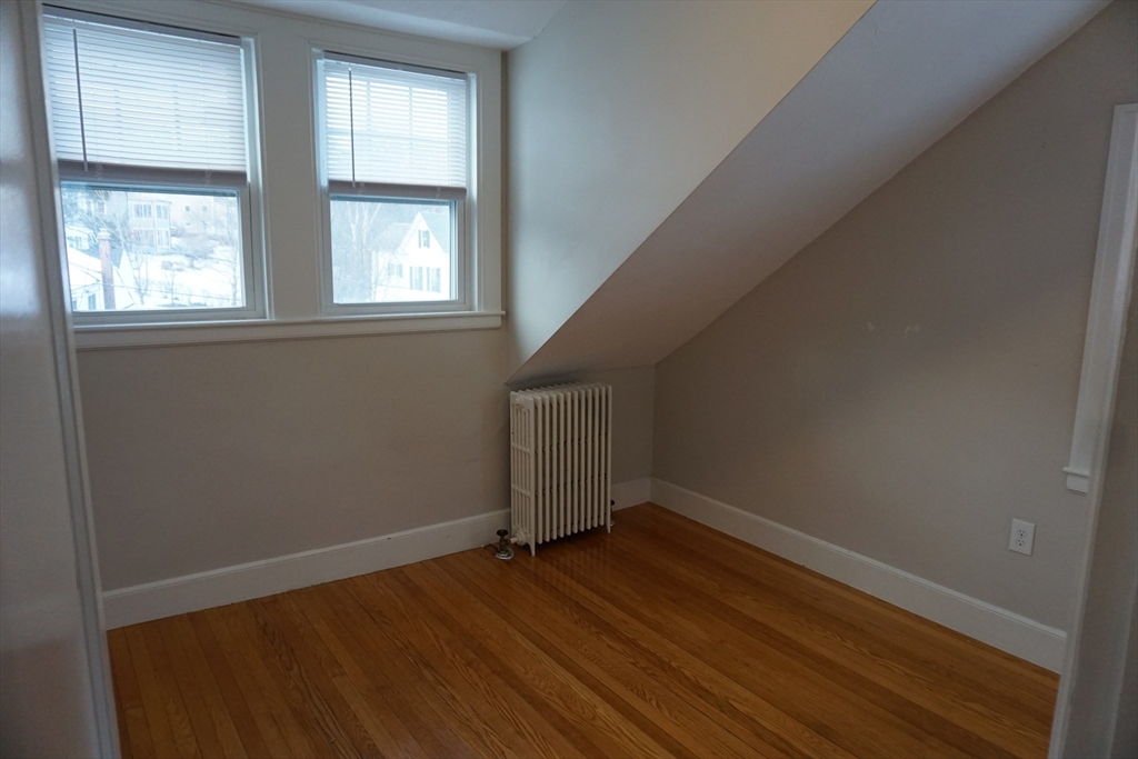 2 Littleton Road, Unit 3 Harvard, MA 01451 - Photo 16 of 19 an empty room with wooden floor and windows