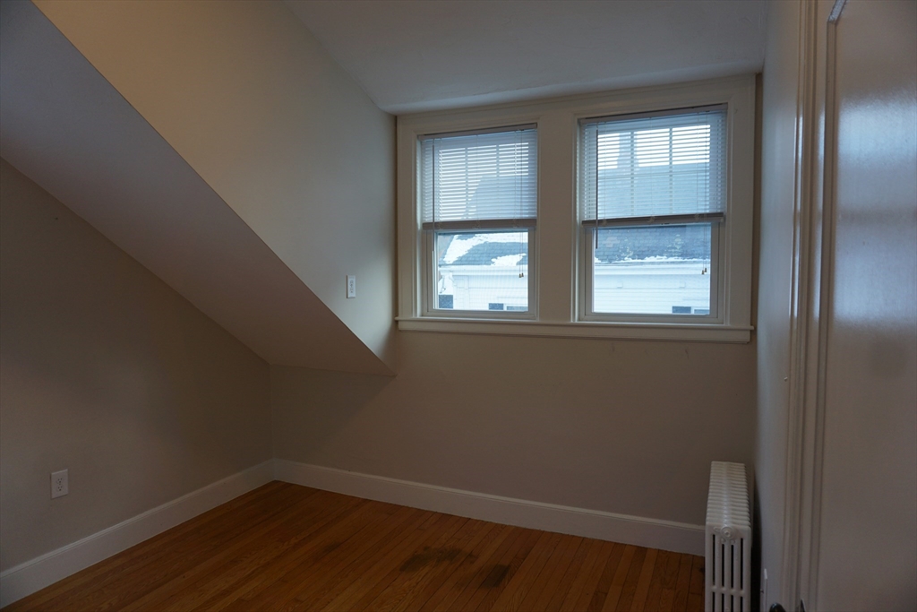 2 Littleton Road, Unit 3 Harvard, MA 01451 - Photo 18 of 19 a view of an empty room with wooden floor and a window