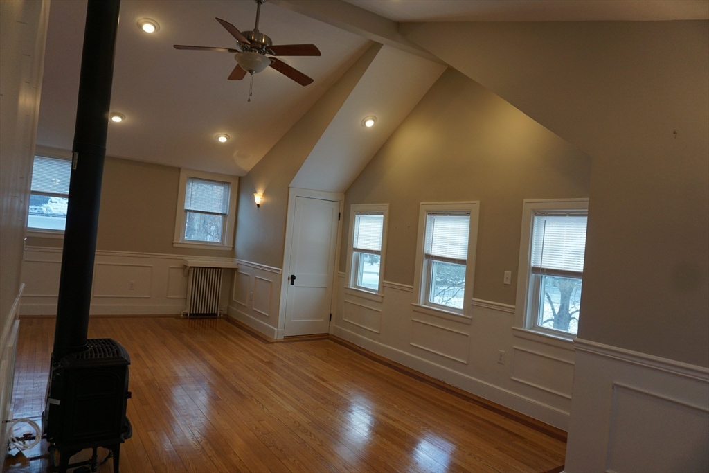 2 Littleton Road, Unit 3 Harvard, MA 01451 - Photo 4 of 19 an empty room with windows and ceiling fan