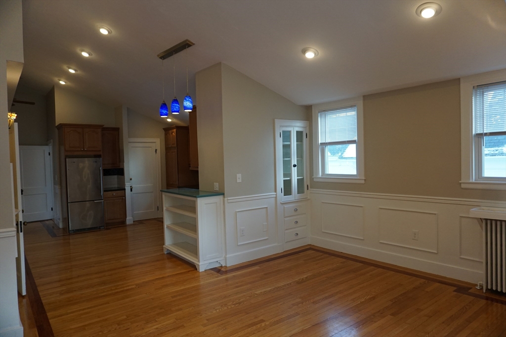2 Littleton Road, Unit 3 Harvard, MA 01451 - Photo 5 of 19 a kitchen with white cabinets and wooden floor