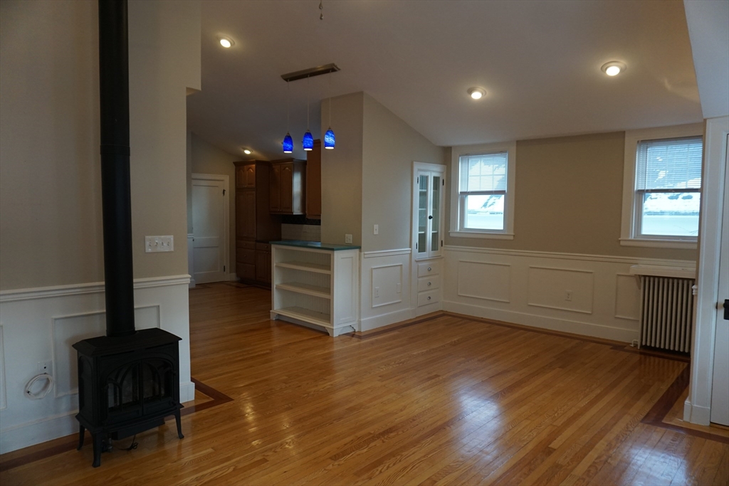 2 Littleton Road, Unit 3 Harvard, MA 01451 - Photo 6 of 19 an empty room with wooden floor and windows
