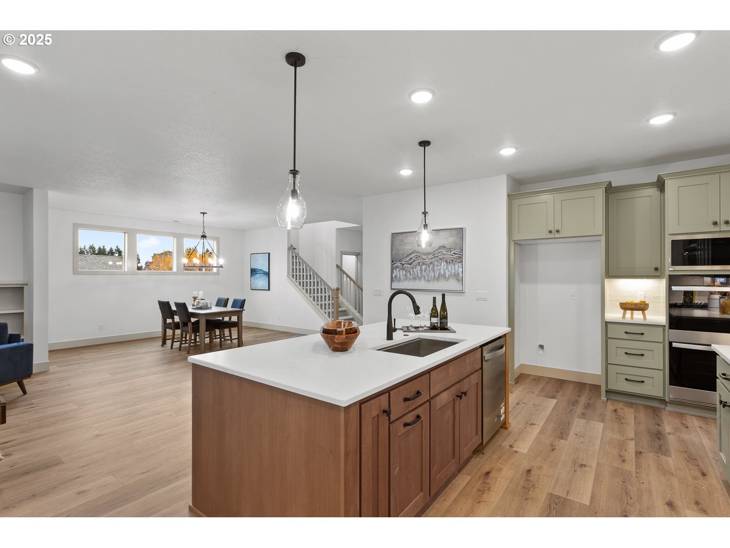 3317 Butte Drive Forest Grove, OR 97116 - Photo 14 of 42 a kitchen with stainless steel appliances granite countertop a sink a stove and a wooden floors