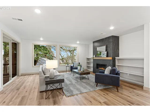 a living room with furniture and a large window