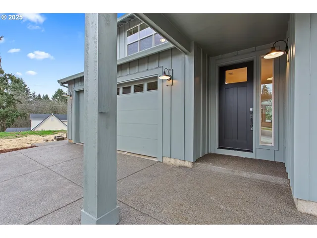 a view of living room with furniture and wooden floor
