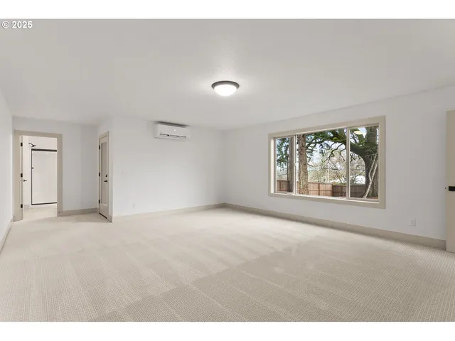 a bathroom with a sink a toilet a mirror and shower