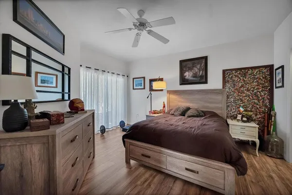 a spacious bathroom with a double vanity sink toilet mirror and shower