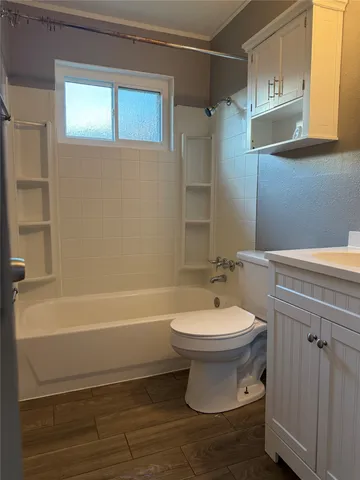 a bathroom with a sink a toilet and bathtub