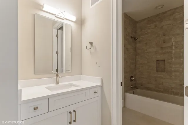 a bathroom with a sink and a bathtub