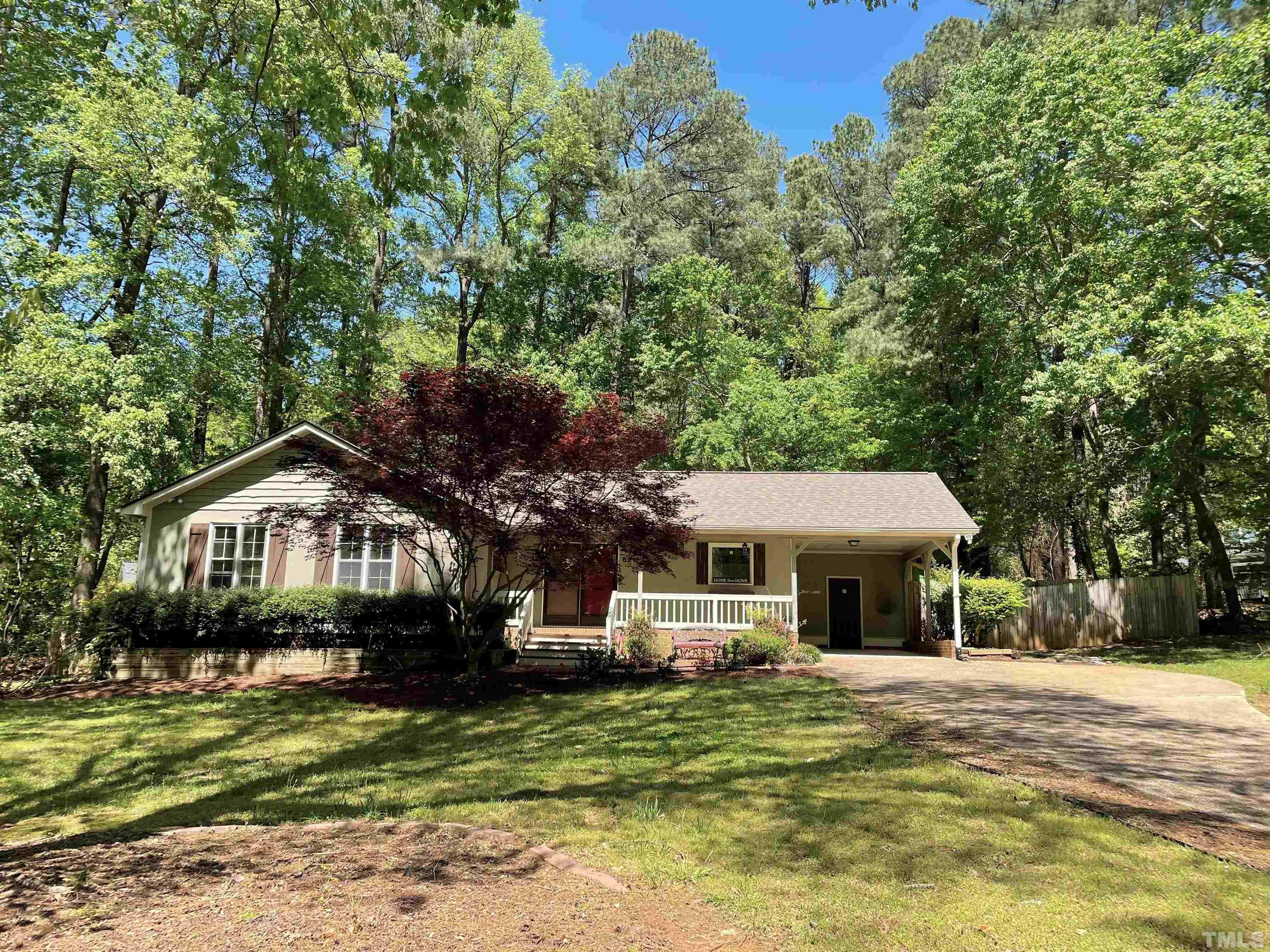 6216 Garrett Road Raleigh, NC 27606 - Photo 1 of 25 a front view of a house with a garden