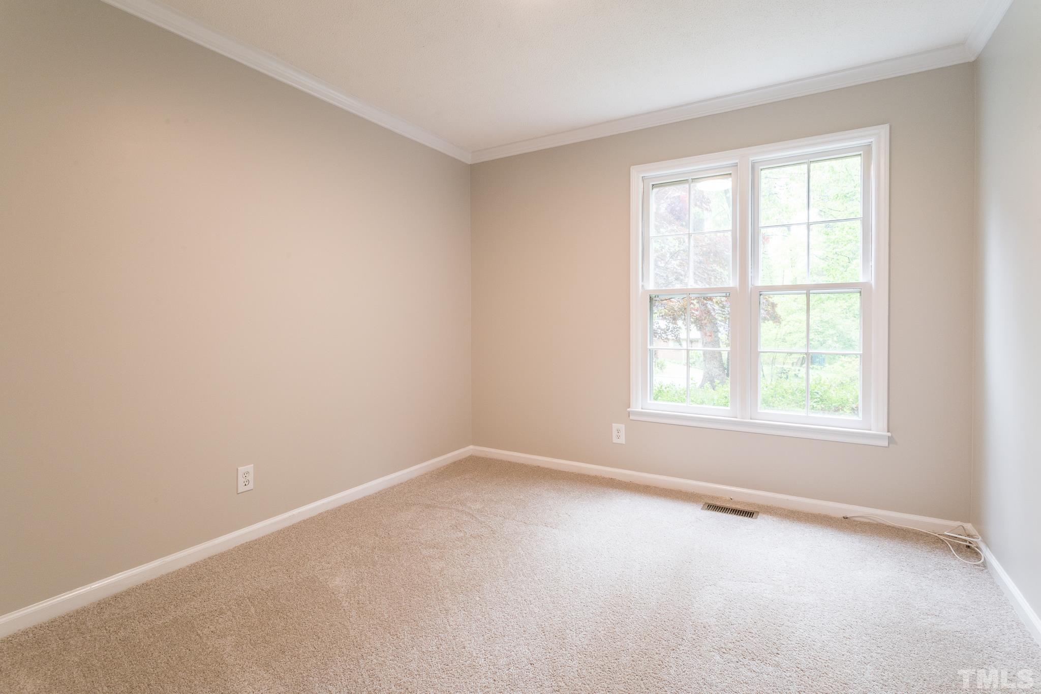 6216 Garrett Road Raleigh, NC 27606 - Photo 14 of 25 an empty room with a window
