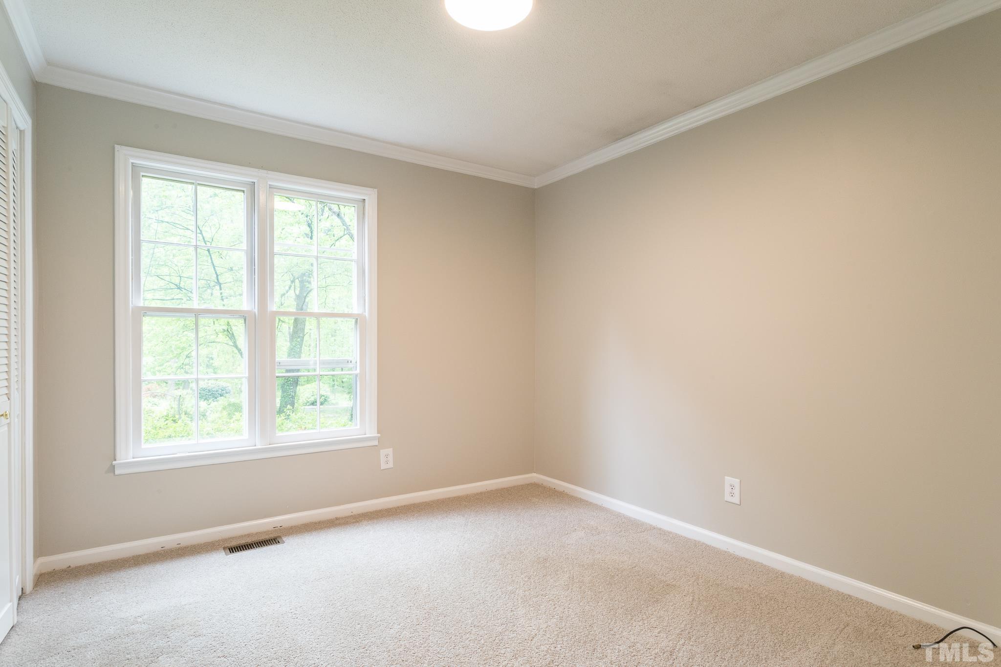 6216 Garrett Road Raleigh, NC 27606 - Photo 16 of 25 an empty room with a window
