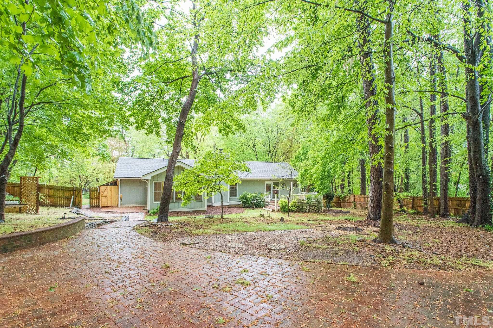 6216 Garrett Road Raleigh, NC 27606 - Photo 23 of 25 a front view of a house with a yard