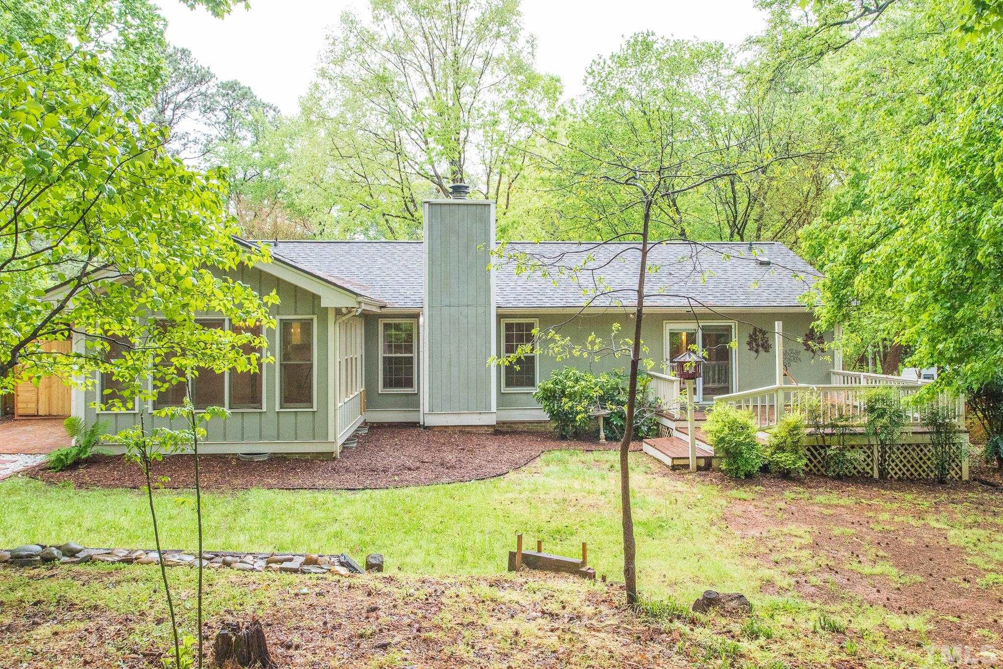 6216 Garrett Road Raleigh, NC 27606 - Photo 24 of 25 a front view of a house with garden