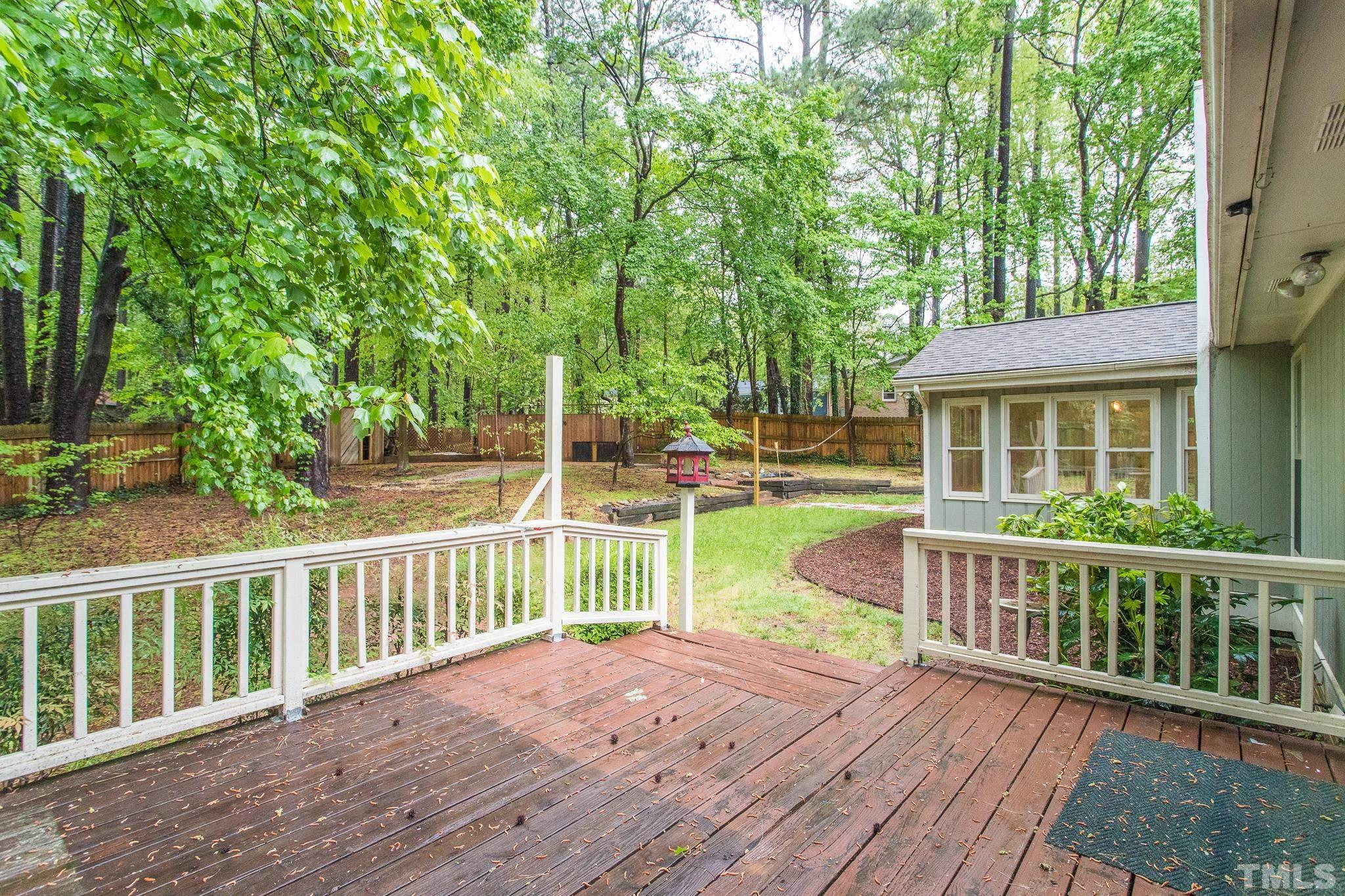 6216 Garrett Road Raleigh, NC 27606 - Photo 25 of 25 a view of a house with a yard and sitting area