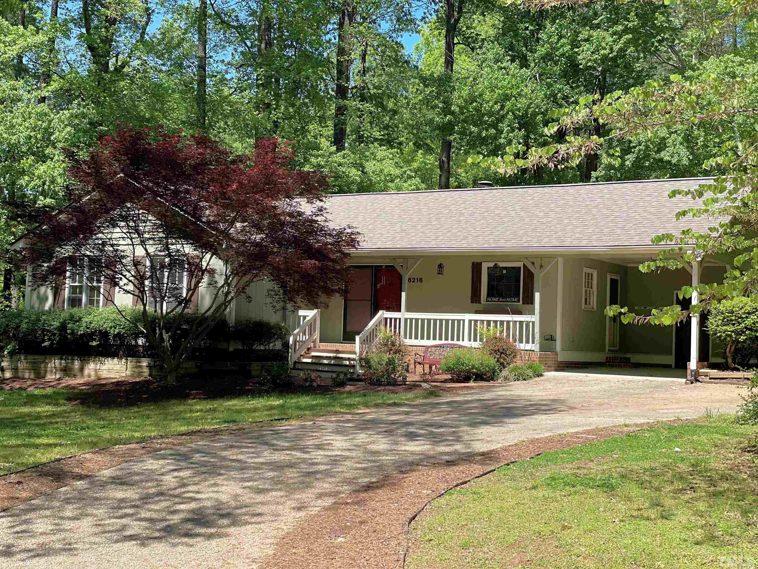 6216 Garrett Road Raleigh, NC 27606 - Photo 3 of 25 front view of a house with a porch
