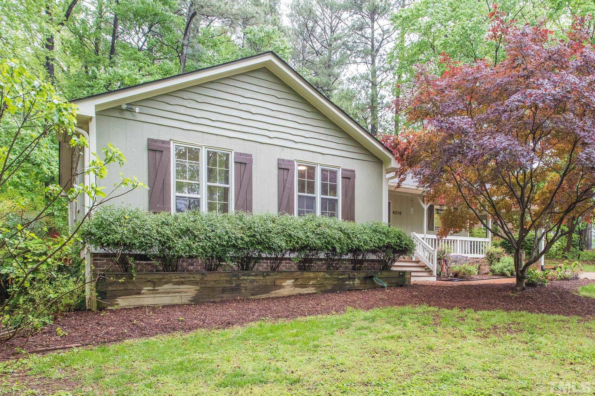 6216 Garrett Road Raleigh, NC 27606 - Photo 4 of 25 a front view of a house with a yard