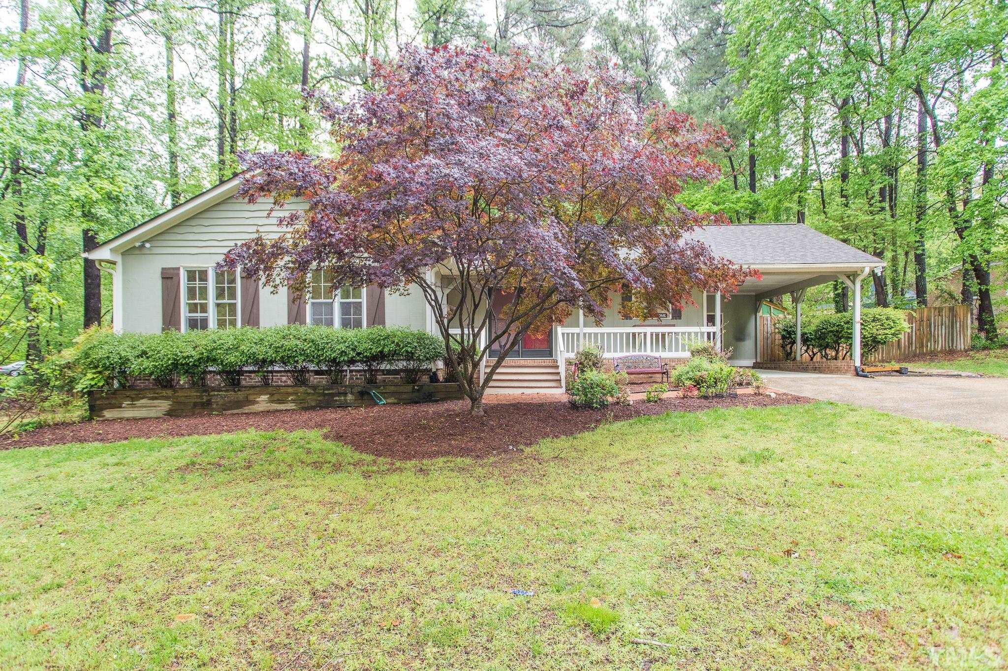6216 Garrett Road Raleigh, NC 27606 - Photo 6 of 25 a view of a house with backyard and sitting area