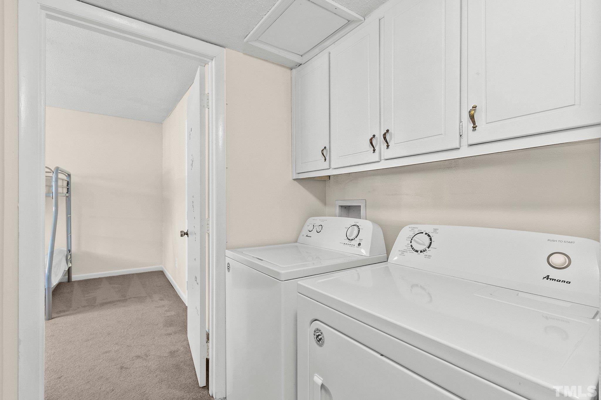 667 Pine Ridge Place, Unit 667 Raleigh, NC 27609 - Photo 24 of 37 a view of storage and utility room with washer and dryer