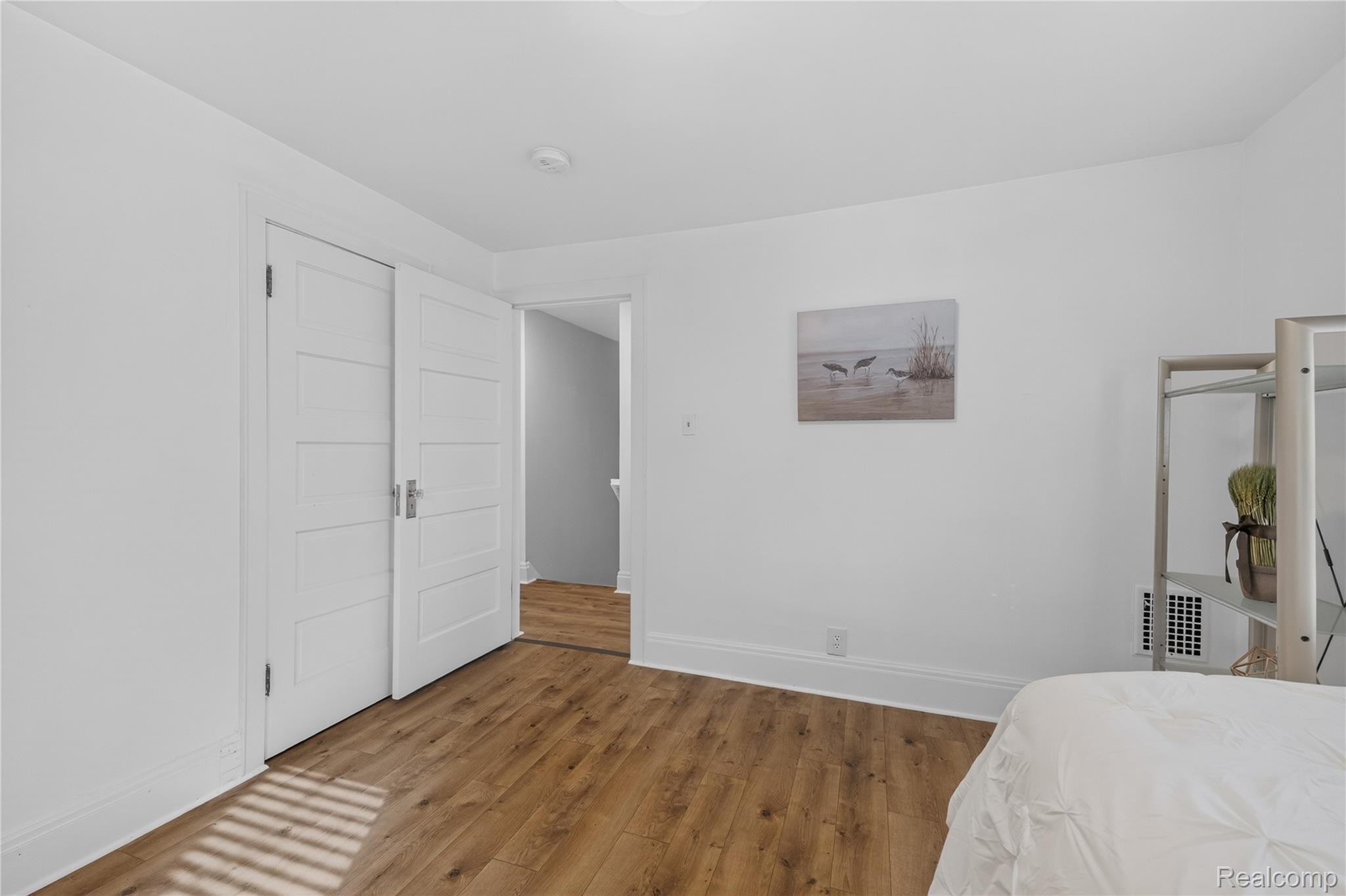 4860 Blue Bush Road Monroe, MI 48162 - Photo 25 of 59 Interior space featuring wood-finish flooring, white painted walls, and white trim