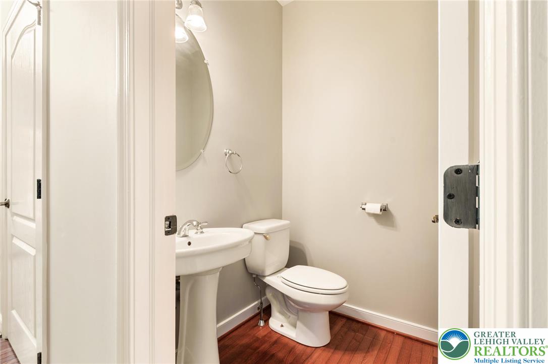 6022 Eli Circle Macungie, PA 18062 - Photo 14 of 29 a white toilet sitting next to a bathroom sink