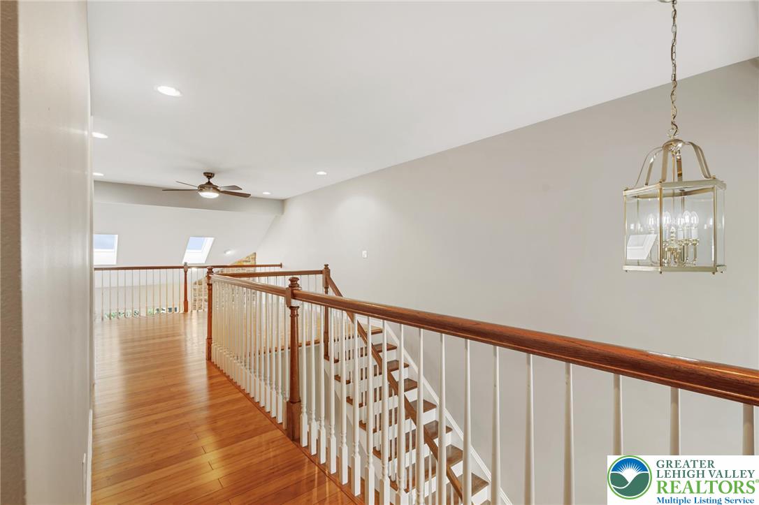 6022 Eli Circle Macungie, PA 18062 - Photo 17 of 29 a view of a hallway with wooden floor and staircase