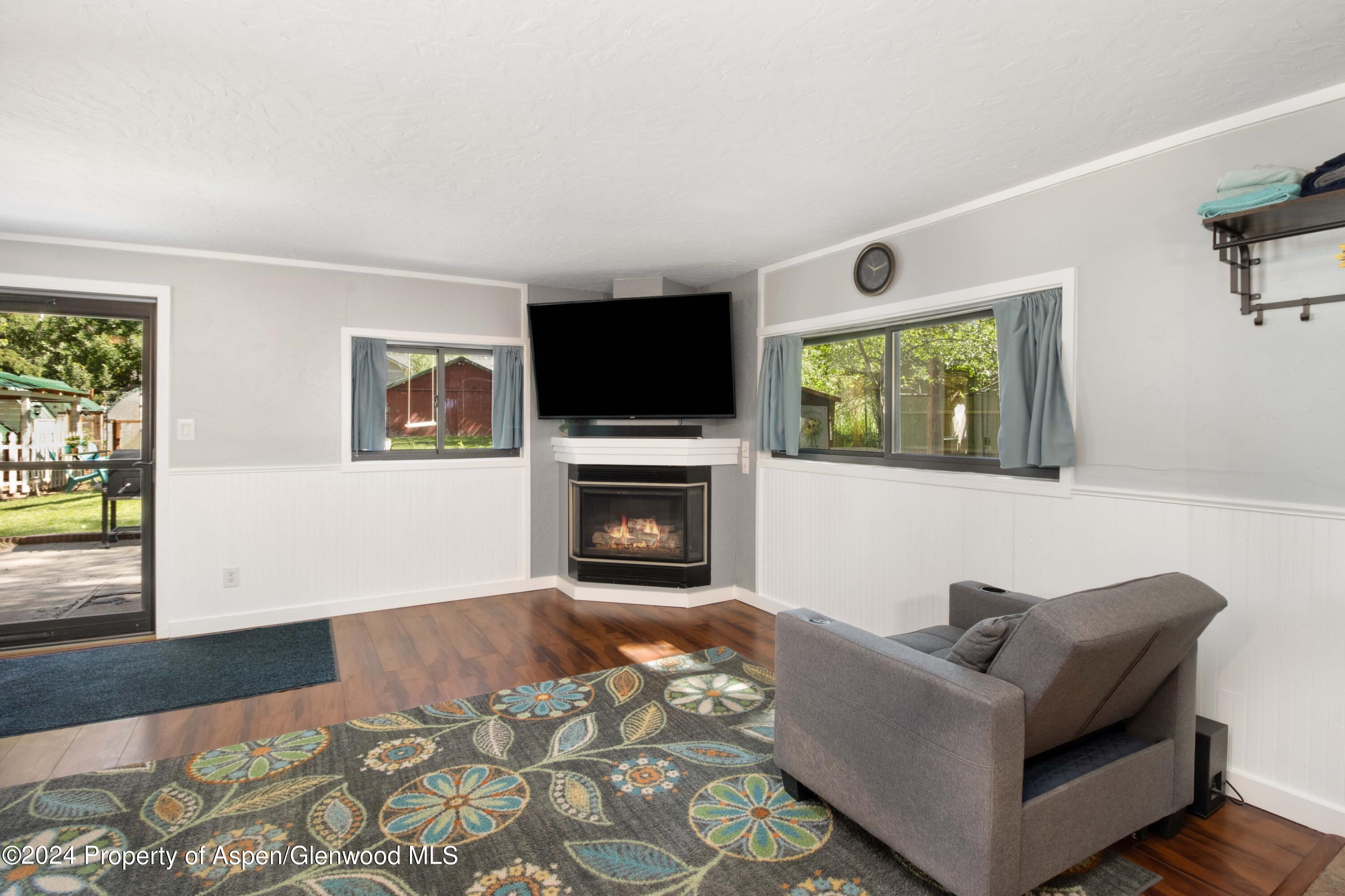 816 East 2nd Street New Castle, CO 81647 - Photo 14 of 32 a living room with furniture and a fireplace