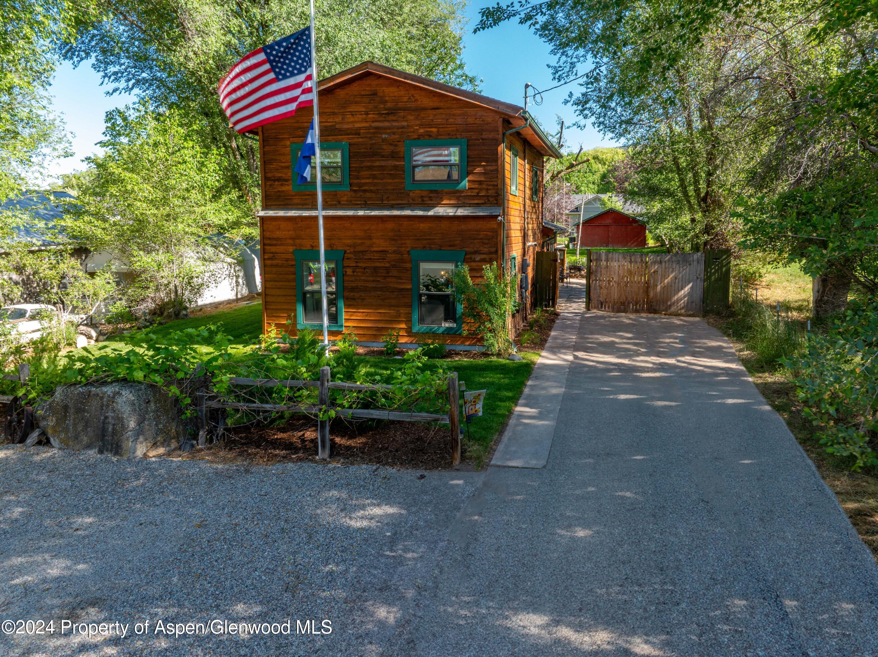 816 East 2nd Street New Castle, CO 81647 - Photo 2 of 32 a front view of a house with a yard