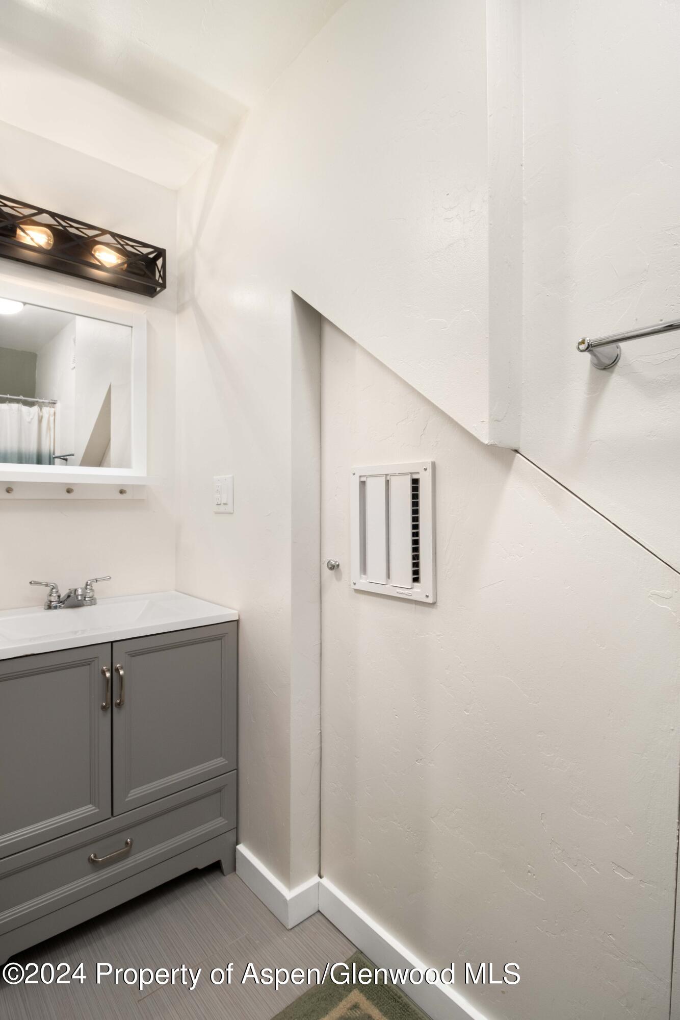 816 East 2nd Street New Castle, CO 81647 - Photo 21 of 32 a bathroom with a window and a shower
