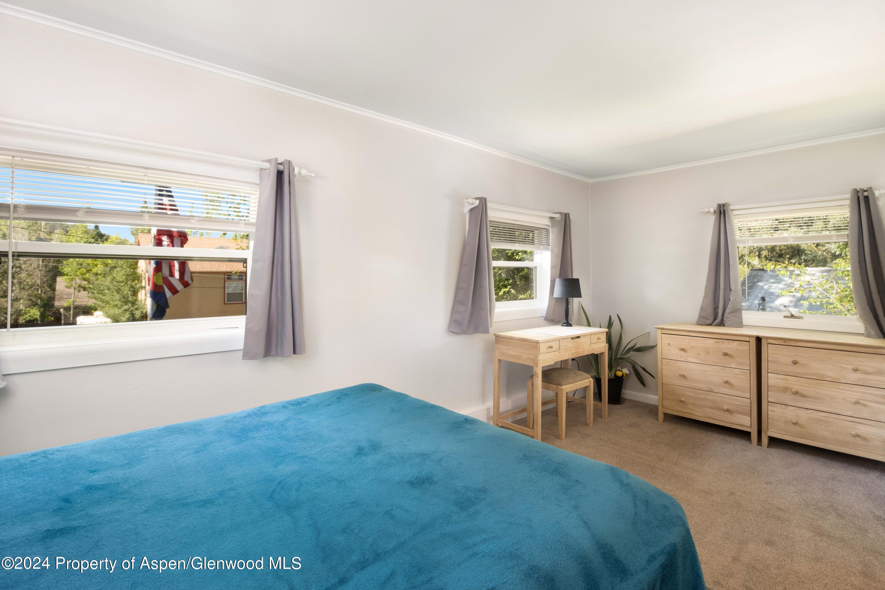 816 East 2nd Street New Castle, CO 81647 - Photo 25 of 32 a bedroom with a bed and a window