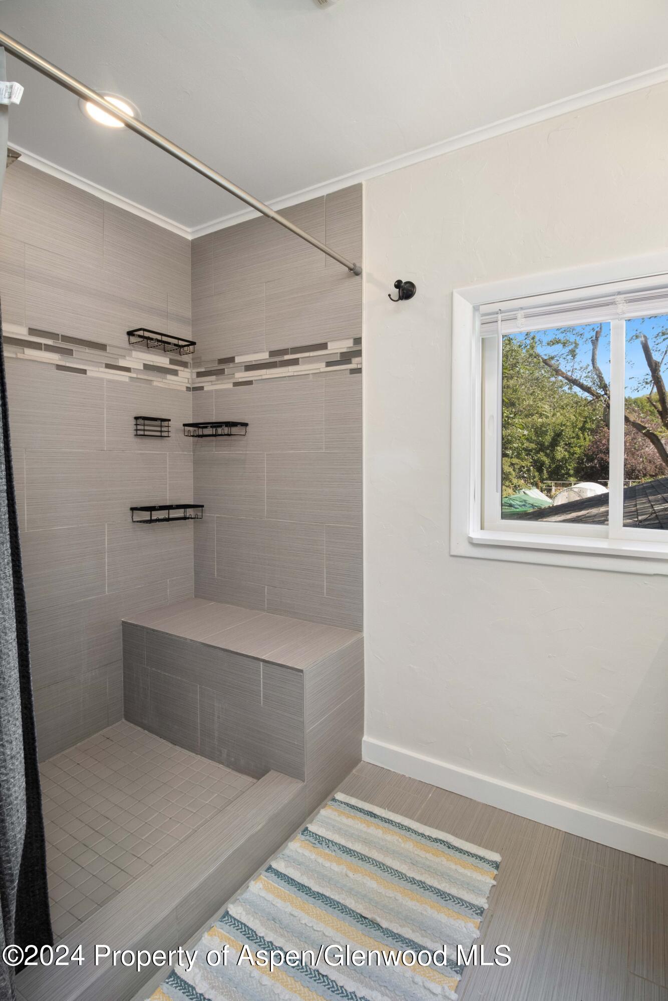 816 East 2nd Street New Castle, CO 81647 - Photo 27 of 32 a bathroom with a bathtub and a shower