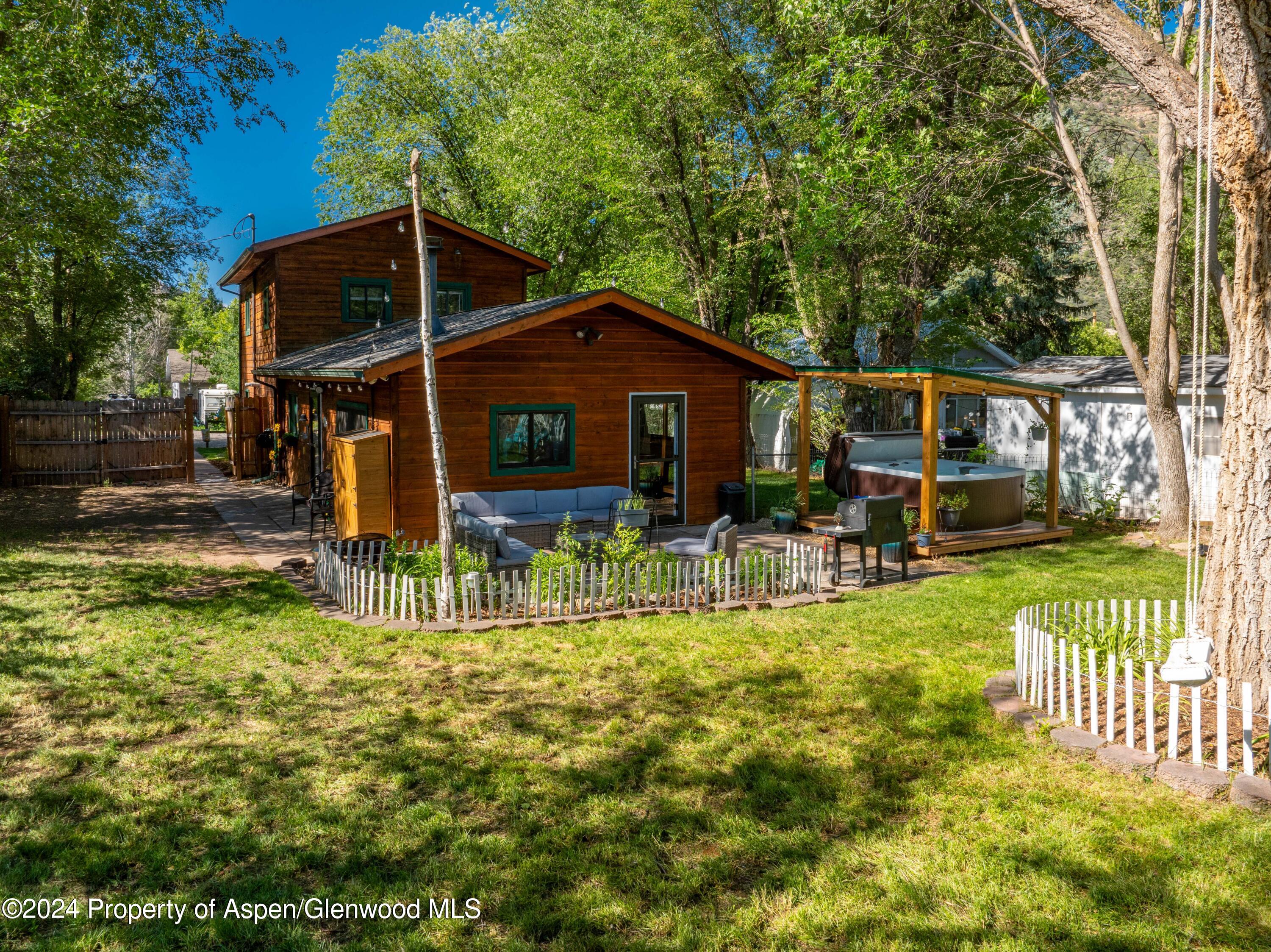 816 East 2nd Street New Castle, CO 81647 - Photo 4 of 32 a view of a house with backyard porch and sitting area