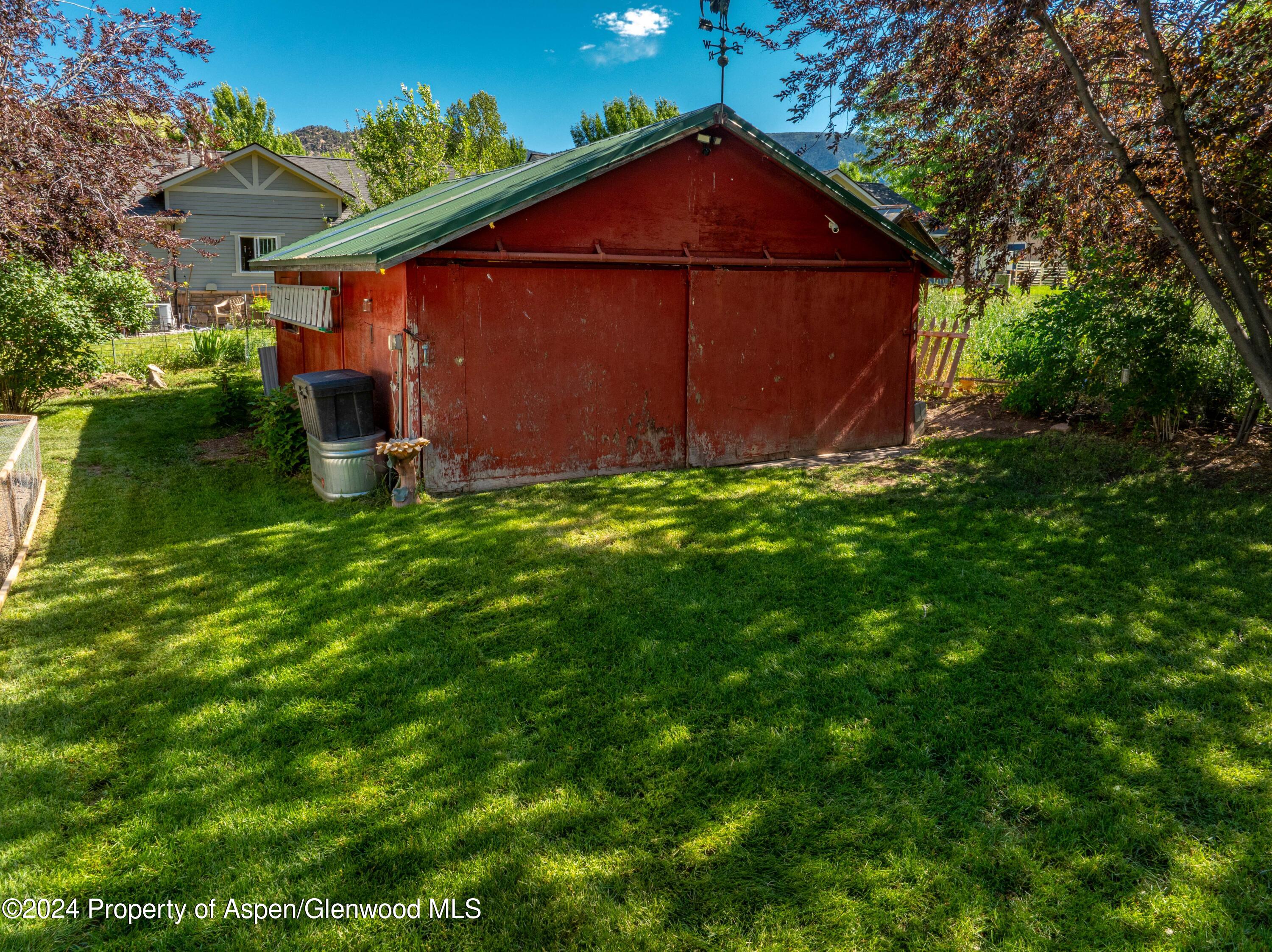 816 East 2nd Street New Castle, CO 81647 - Photo 9 of 32 a front view of a house with garden