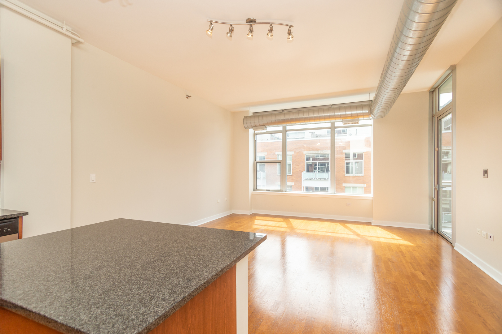 901 West Madison Street, Unit 509 Chicago, IL 60607 - Photo 4 of 14 a view of an empty room with a window