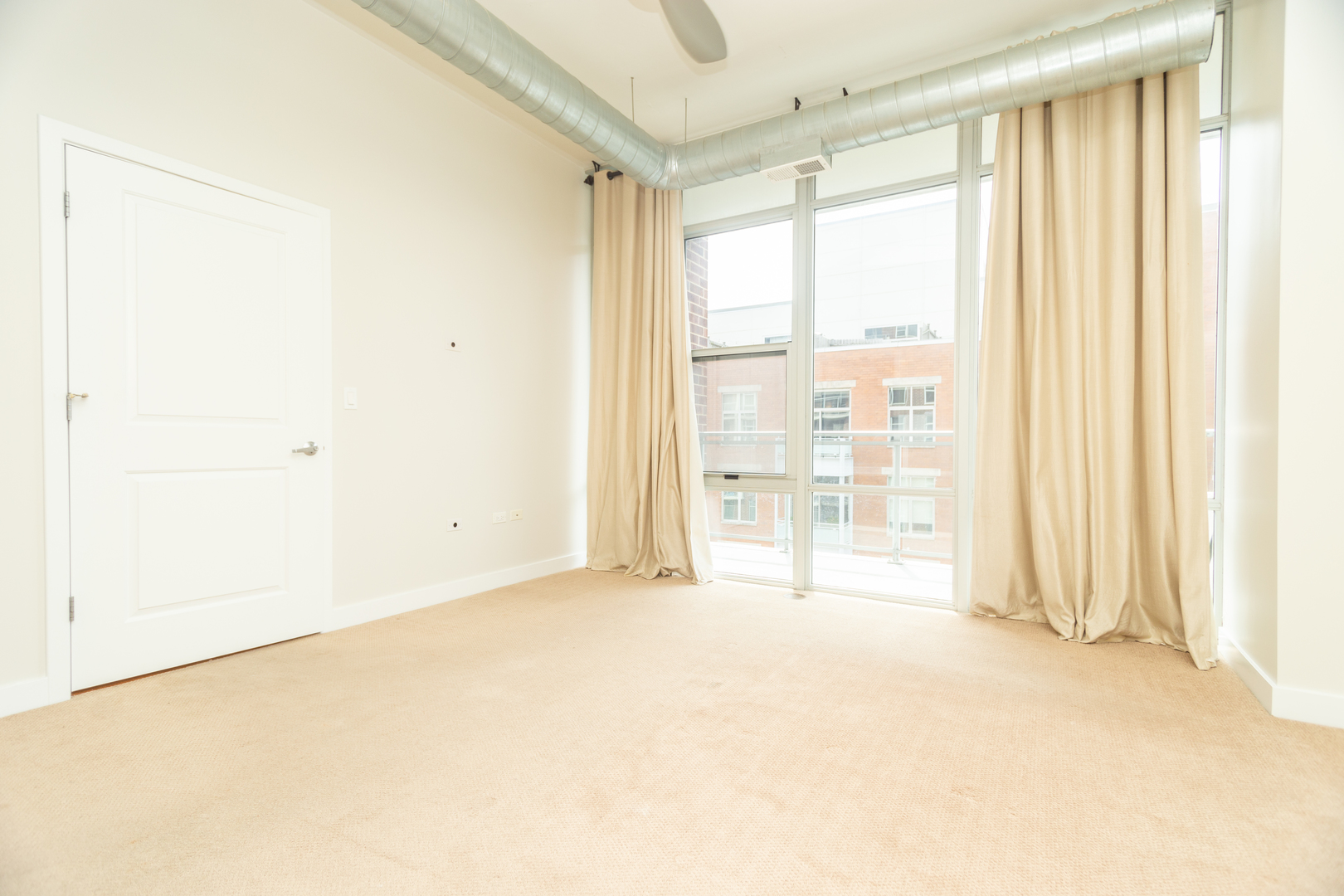 901 West Madison Street, Unit 509 Chicago, IL 60607 - Photo 5 of 14 a view of an empty room with a window