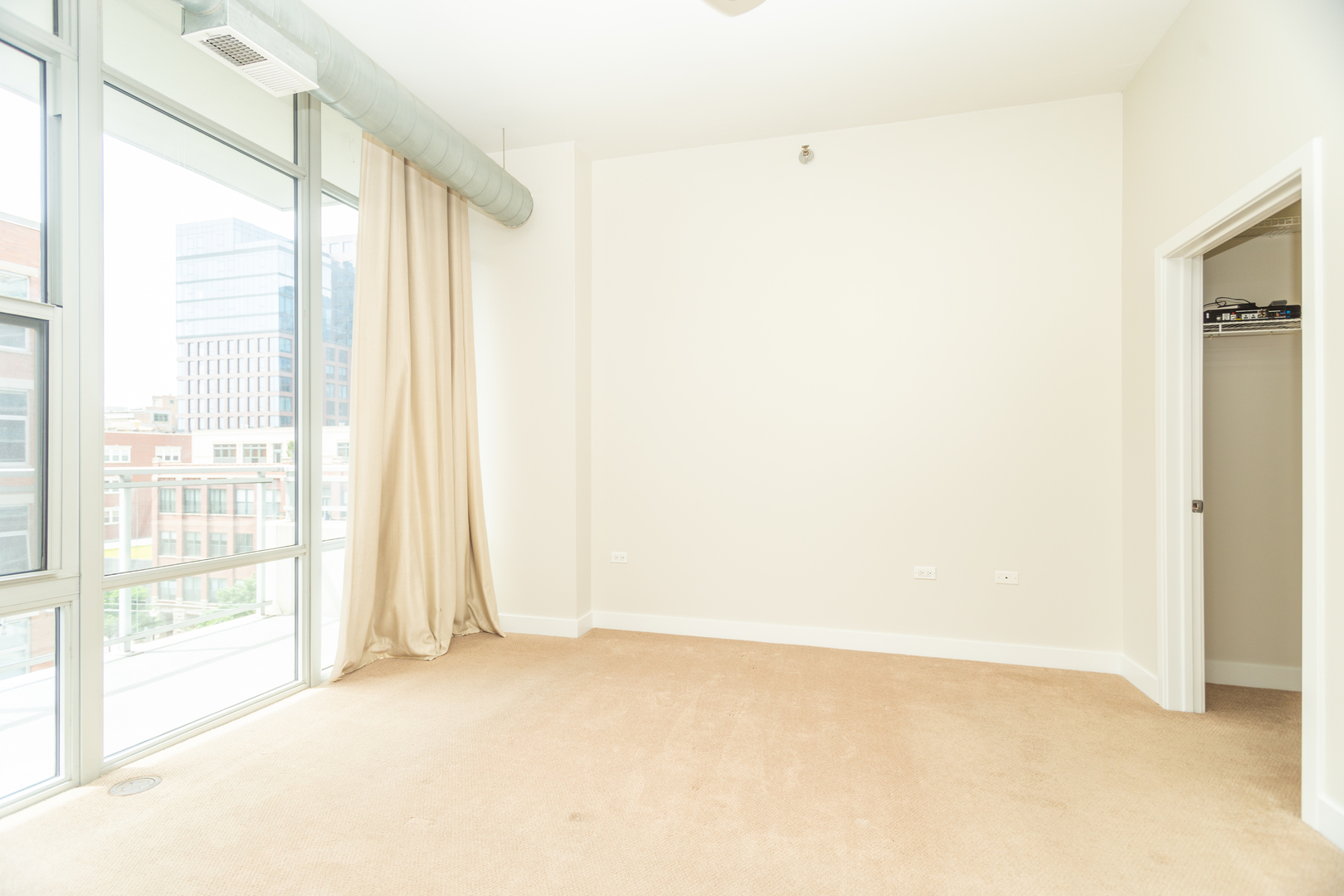 901 West Madison Street, Unit 509 Chicago, IL 60607 - Photo 6 of 14 a view of an empty room with a window
