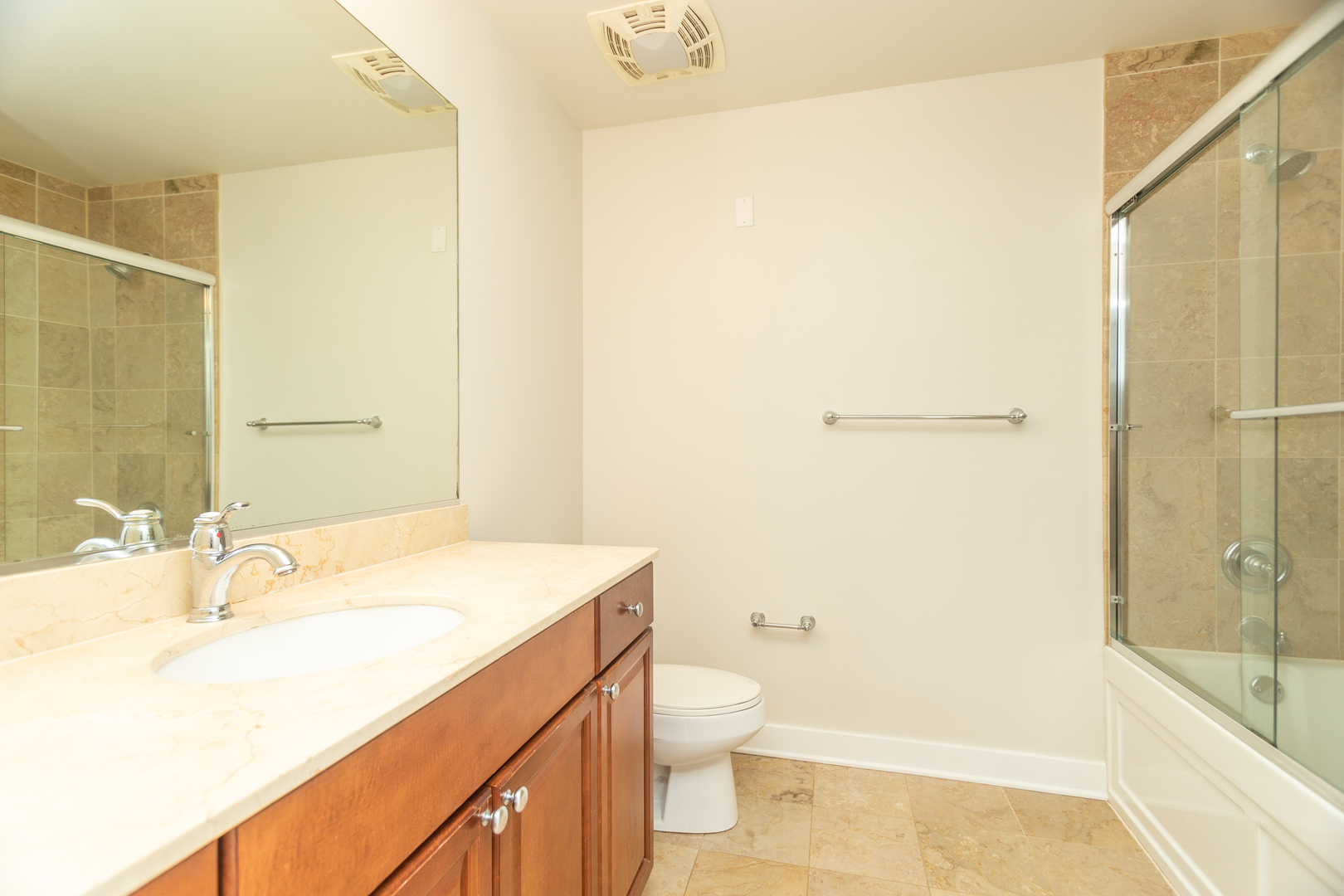 901 West Madison Street, Unit 509 Chicago, IL 60607 - Photo 7 of 14 a bathroom with a sink a toilet and shower