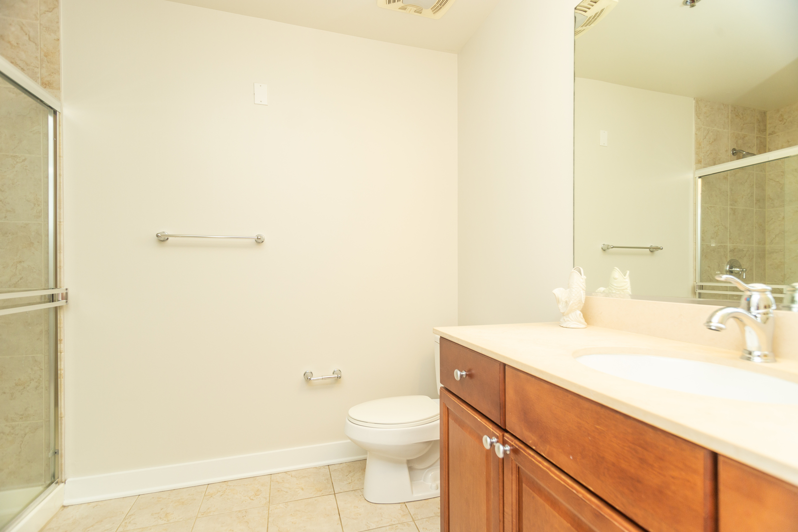 901 West Madison Street, Unit 509 Chicago, IL 60607 - Photo 10 of 14 a bathroom with a sink a toilet and shower