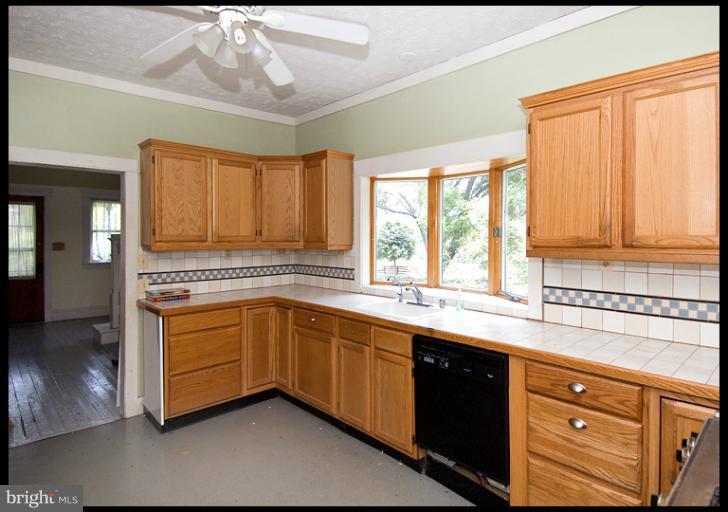 2311 Garrett Road White Hall, MD 21161 - Photo 6 of 13 a kitchen with stainless steel appliances a sink stove and cabinets
