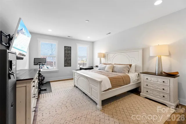 a bedroom with a bed and a desk